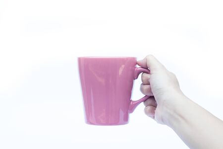 Woman hands holding coffee cup on white backgroundの写真素材