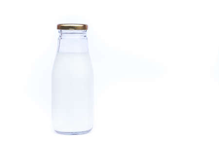 Traditional glass milk bottle on white background, stock photoの写真素材