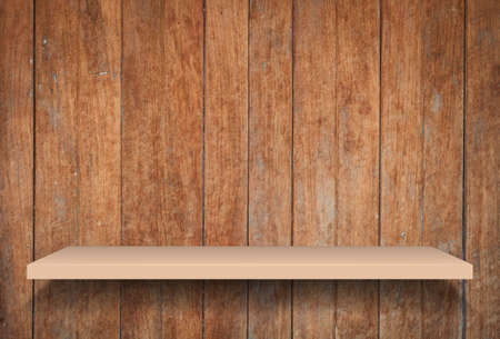 Empty brown shelf on old wooden background, stock photoの写真素材