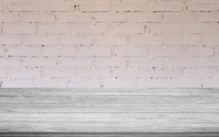 Top of black and white wooden table with white brick wall decorated in coffee shopの写真素材