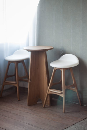 Elegant chairs with empty concrete backgroundの写真素材