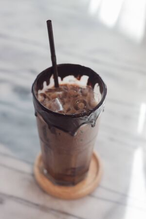 Ice coffee on wooden tableの写真素材