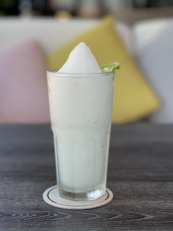 Lime smoothie in glass on grey table, stock photoの写真素材