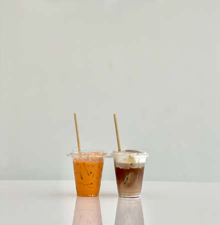 A glass of iced mocha and iced thai milk tea, stock photoの写真素材