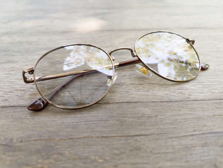 Eyeglasses on old wooden table, stock photoの写真素材