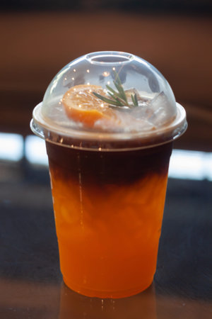 Glass of americano mixed with orange juice, stock photo