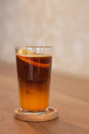 Glass of americano mixed with orange juice, stock photoの写真素材