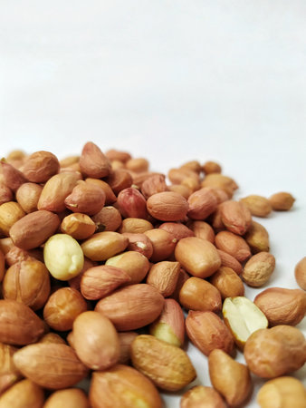 Peanuts on a white background. Close-up. Selective focus.の写真素材