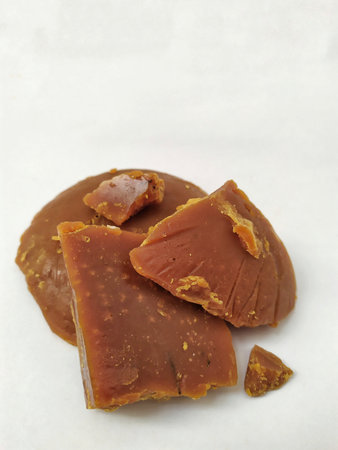Slices of salted caramel isolated on a white background.の写真素材