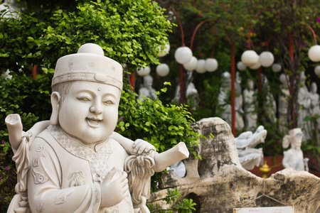 Face of marble Child Carving in the gardenの写真素材