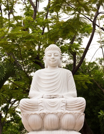 Buddha the is marbling carve white that sit the concentrationの写真素材