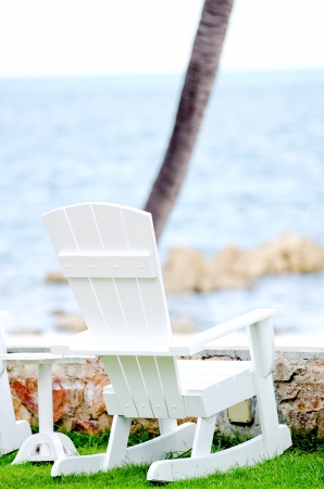 wood chair at the garden near the seaの写真素材