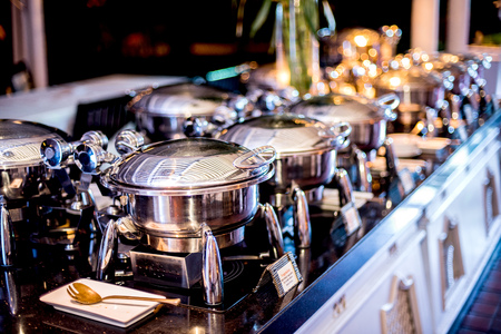 Buffet Table with Row of Food Service Steam Pansの写真素材