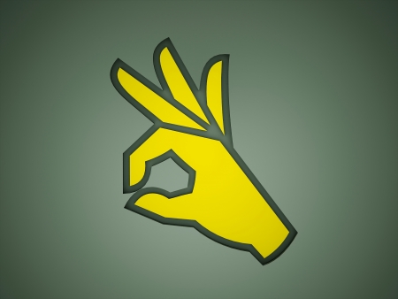O.K. hand on yellow colorの写真素材