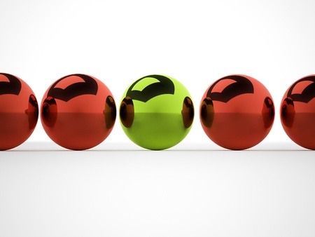 Metal spheres one is green with shadowsの写真素材