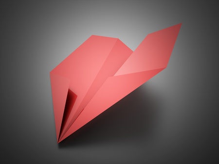 Paper aeroplane red on white backgroundの写真素材