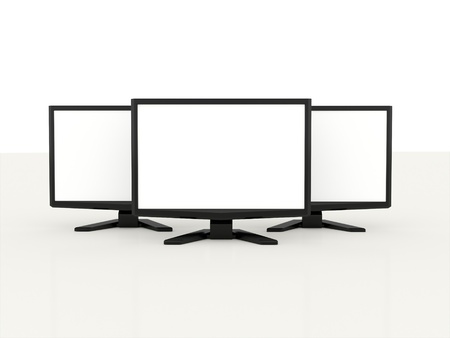 Three LCD monitors with white screen on white backgroundの写真素材
