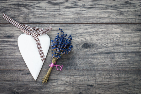Valentines day card. Decorative vintage background with wooden heart and lavender. Top of view valentines day background.の写真素材