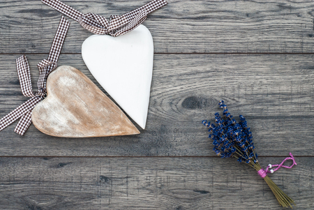 Valentines day card. Decorative vintage background with wooden heart and lavender. Top of view valentines day background.の写真素材