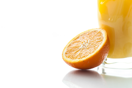 Fresh orange juice on white background with orange.の写真素材