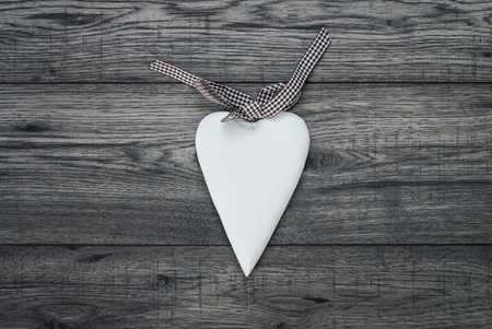 Valentines day card. Decorative vintage background with wooden heart. Top of view valentines day background.の写真素材