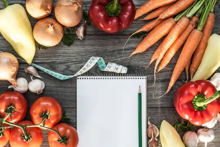 Vegetable mixed fitness concept. Top view vegetable concept on wooden background with text book.の写真素材