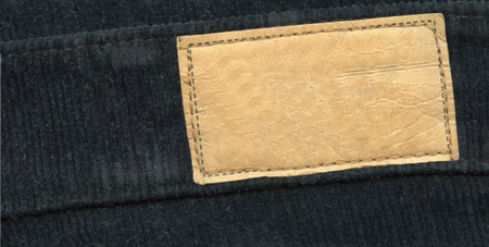 Blank leather label on black jeans