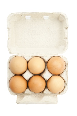 6 eggs in a box isolated on a white backgroundの写真素材
