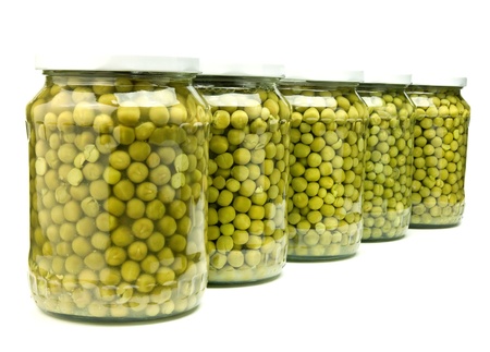 five jars of preserved green peas isolated on whiteの写真素材