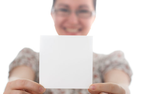 Woman holding blank card, on white background