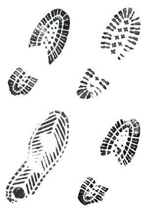 Black shoe prints on white background