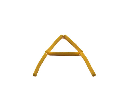 stick biscuit arranged in a character of A on white background