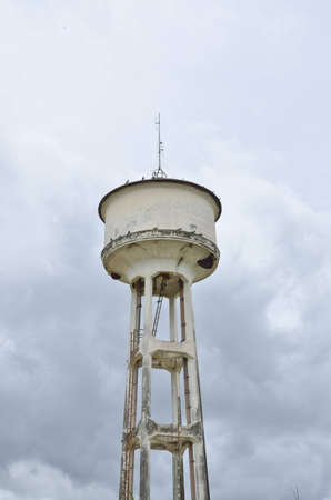old watertank and cloudy skyの写真素材