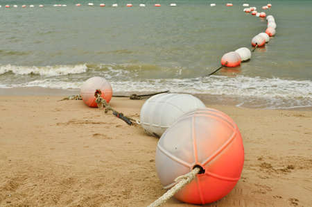 safety buoys on a beachの写真素材