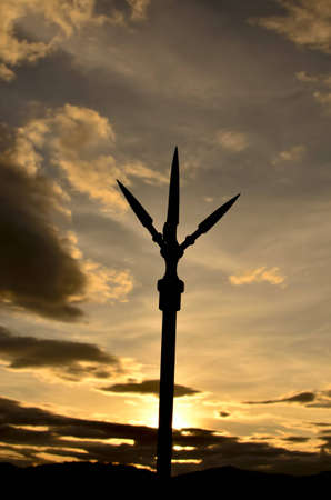 lightning rod silhouete at sunsetの写真素材