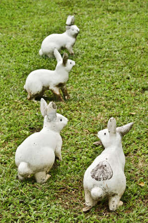 four rabbit statue in public parkの写真素材