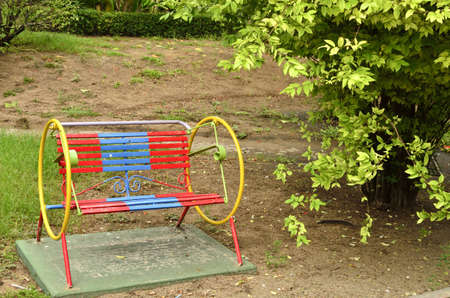 colorful metal bench in gardenの写真素材