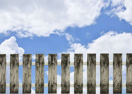 old wooden fence and blue skyの写真素材