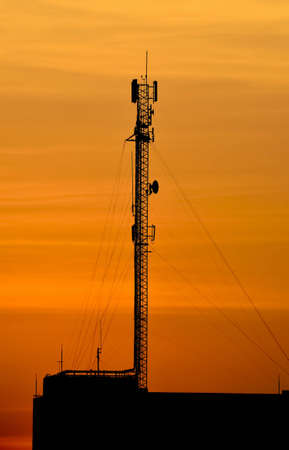 communication antenna in orange sunsetの写真素材