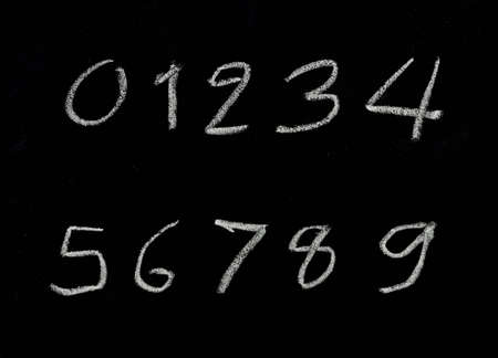 alphabet in numbers written with chalk on a blackboard の写真素材