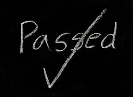 written passed on a blackboard.の写真素材