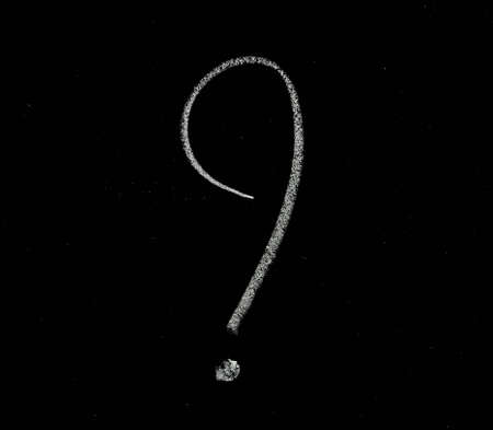Question mark written with chalk on a blackboardの写真素材
