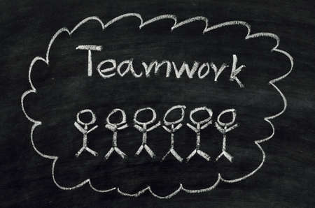 Teamwork concept written on blackboardの写真素材