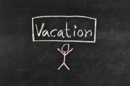 abstract vacation written on blackboardの写真素材