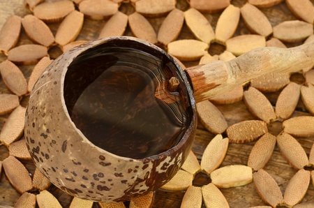 a dipper made from coconut contained drinking waterの写真素材