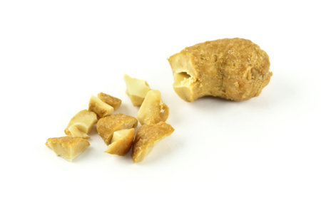 salted cashew nuts isolated on white backgroundの写真素材