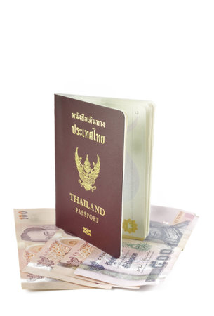 Thailand passport and banknote on white background.の写真素材