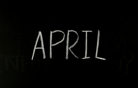 hand writing "april" on blackboardの写真素材