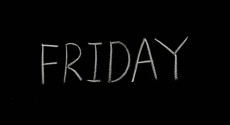 hand writing "friday" on blackboardの写真素材
