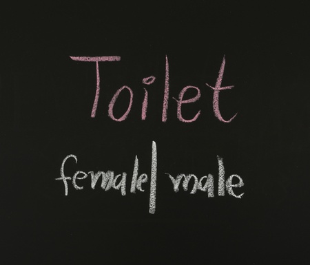 writing toilet sign on blackboardの写真素材